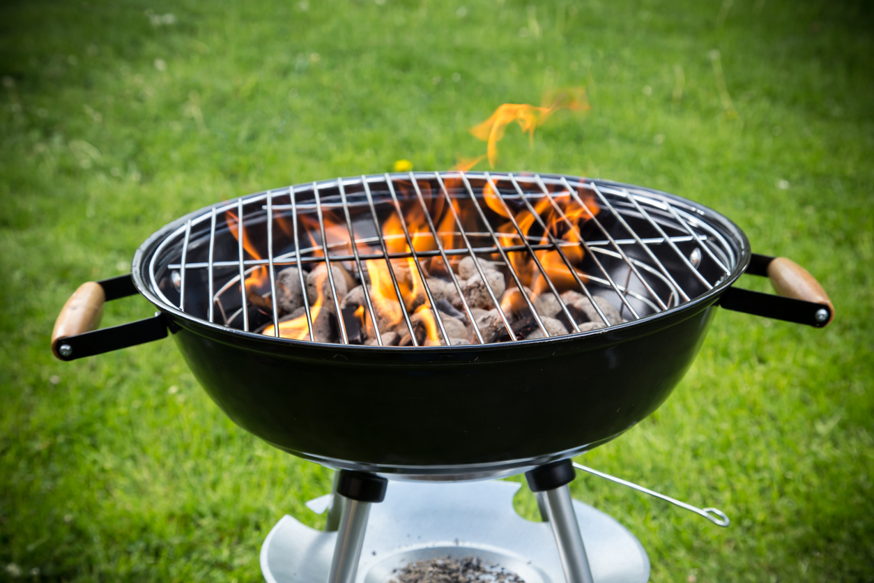 a charcoal grill in the garden