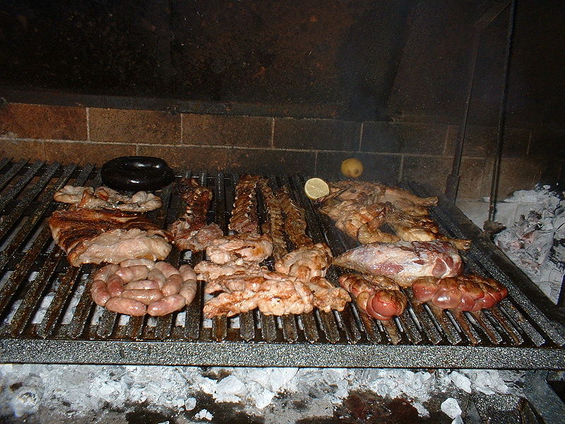 Argentinian asado being cooked on a grill