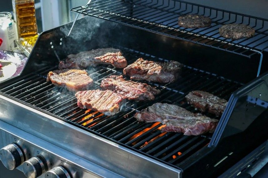 BBQ being cooked on a simple gas grill