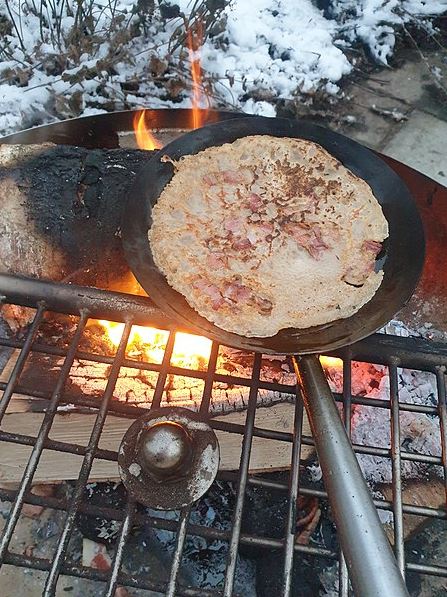 Swedish pancake being grilled on a cast iron pan